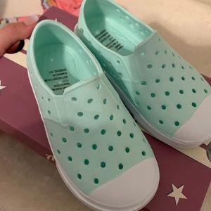 Never worn rubber slip on sneakers